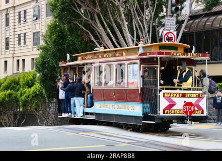 San Francisco cable car descending a hill in Powell Street San Francisco California USA Stock Photo