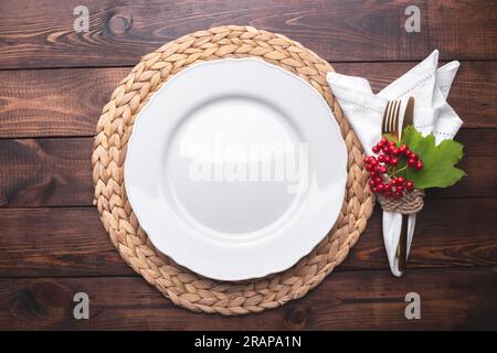 Autumn table setting on old wooden table Thanksgiving or Octoberfest vintage background copy space Stock Photo