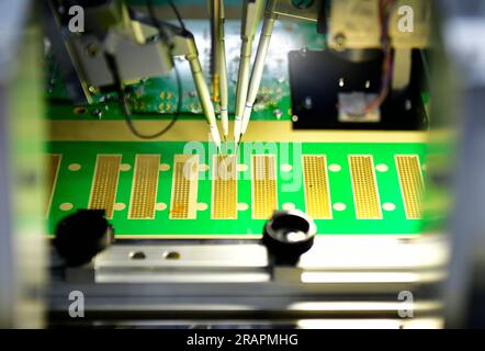 Automated technology of Assembly of computer circuit board Electronic production in machinery and technology, Stock Photo