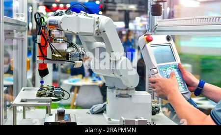 Engineer check and control automation Modern Robot system in factory, Industry Robot concept Stock Photo