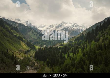 View of the mountains and snow-covered peaks. A large Almaty lake in the early morning in sunny weather. Almaty. Kazakhstan Stock Photo