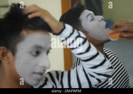 Mime artists from a mime group,'Sur-Pancham', are getting ready for a performance in a green room of an auditorium at Agartala. Tripura, India. Stock Photo