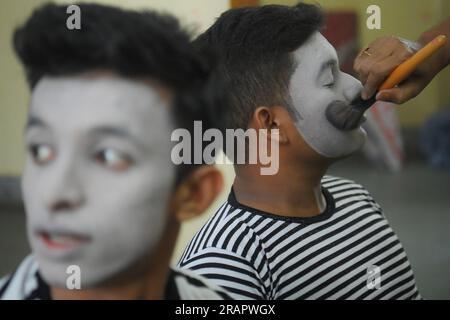 Mime artists from a mime group,'Sur-Pancham', are getting ready for a performance in a green room of an auditorium at Agartala. Tripura, India. Stock Photo