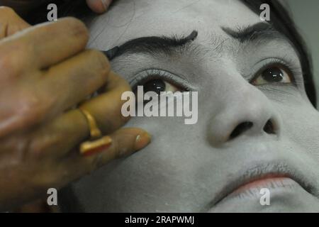 Mime artists from a mime group,'Sur-Pancham', are getting ready for a performance in a green room of an auditorium at Agartala. Tripura, India. Stock Photo