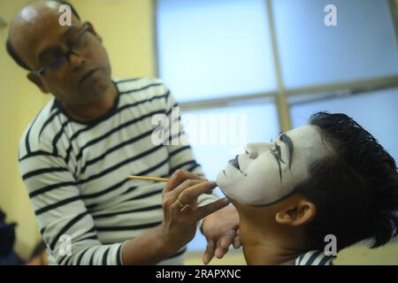 Mime artists from a mime group,'Sur-Pancham', are getting ready for a performance in a green room of an auditorium at Agartala. Tripura, India. Stock Photo