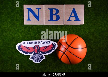 January 30, 2023, Springfield, USA. The emblem of the National Basketball Association club Atlanta Hawks on the green lawn of the stadium. Stock Photo