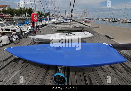 05 July 2023, Mecklenburg-Western Pomerania, Warnemünde: On the pontoons in the marina on the Baltic Sea are covered sailboats. All races of the Warnemünder Woche are canceled for 05.07.2023. According to the German Weather Service (DWD), violent storms are expected especially in the north of Germany, but the focus of the wind development is indicated for the North Sea and the adjacent inland from East Frisia to the northern half of Schleswig-Holstein. The storm will bring gale-force winds with wind speeds of 120 kilometers per hour along the coasts during the course of the day. Photo: Bernd W Stock Photo