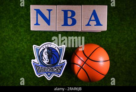 January 30, 2023, Springfield, USA. The emblem of the Dallas Mavericks National Basketball Association club on the green lawn of the stadium. Stock Photo