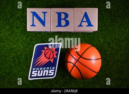 January 30, 2023, Springfield, USA. The emblem of the Phoenix Suns National Basketball Association club on the green lawn of the stadium. Stock Photo