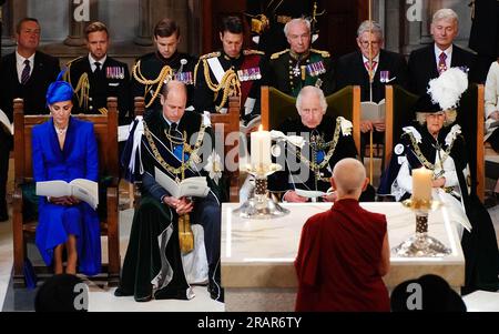 (front row left to right) The Princess of Wales and the Prince of Wales known as the Duke and Duchess of Rothesay while in Scotland, King Charles III and Queen Camilla listen to blessings and greetings from Getsulma - Ani Rinchen Khandro, Director of Kagyu Samye Dzong Edinburgh, Tibetan Buddhist Meditation Centre) during the National Service of Thanksgiving and Dedication for King Charles III and Queen Camilla, and the presentation of the Honours of Scotland, at St Giles' Cathedral, Edinburgh. Picture date: Wednesday July 5, 2023. Stock Photo