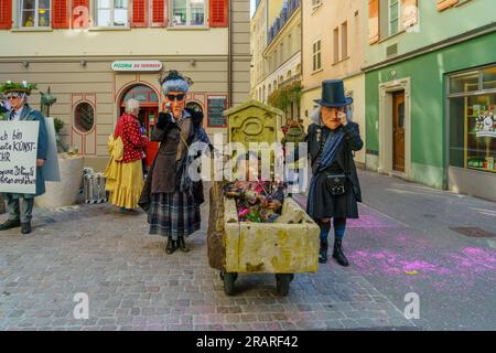 Lucerne, Switzerland - February 20, 2023: Scene of streets with participant and others, some in costumes, during the Fasnacht Carnival, in Lucerne (Lu Stock Photo