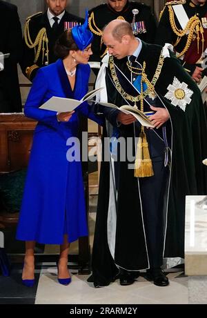 Britain's Prince William, the Prince of Wales, right and Kate, the Princess of Wales, known as the Duke and Duchess of Rothesay while in Scotland, speak, during the National Service of Thanksgiving and Dedication for Britain's King Charles III and Queen Camilla, at St Giles' Cathedral, in Edinburgh, Wednesday, July 5, 2023. Two months after the lavish coronation of King Charles III at Westminster Abbey in London, Scotland is set to host its own event to mark the new monarch’s accession to the throne. (Aaron Chown/Pool Photo via AP)