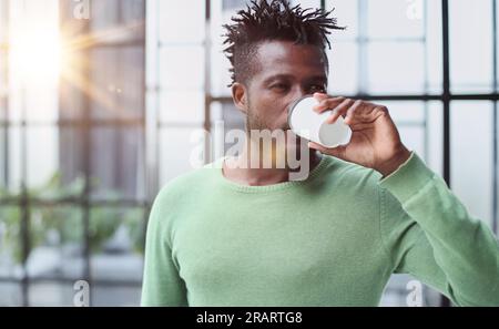 Smiling friendly handsome young male call centre operator. Stock Photo