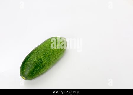 Fresh green and healthy cucumbers on wooden board Stock Photo