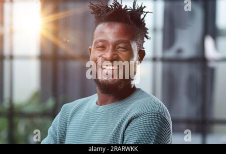 Thoughtful young black man looking straight ahead Stock Photo