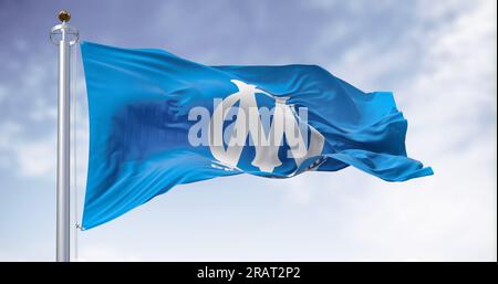 Marseille, FR, June 10 2023; Flag of Olimpique de Marseille football club waving on a clear day. French Ligue 1 Professional football team. Illustrati Stock Photo