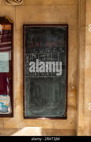 A chalk board in Sidney Sussex College, University of Cambridge, show information about the Lent Bumps rowing race. Stock Photo