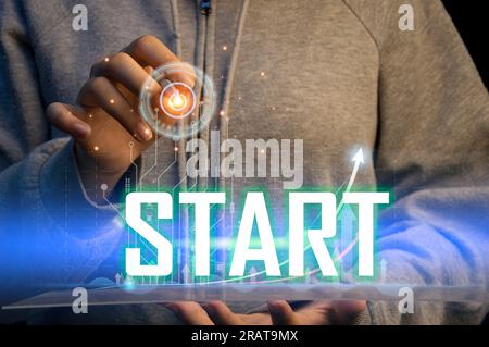 Concept of businessman pressing start button, business success Stock Photo