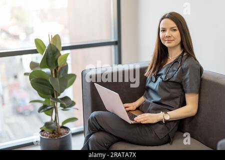 Portrait of a young physician on a couch at clinic Stock Photo