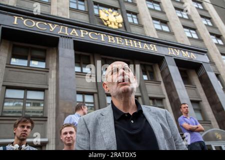 Moscow, Russia. 18th of July, 2013  Russian-Georgian writer Boris Akunin (C) is seen during an unauthorized opposition rally in defense of Alexey Navalny, on Okhotny Ryad street in the center of Moscow, Russia Stock Photo