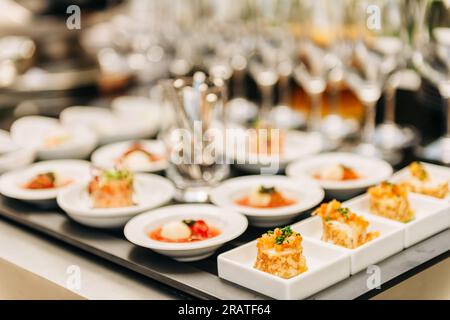 Plates with appetizers on some festive event, party or wedding reception Stock Photo