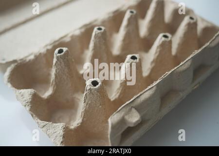 egg carton without eggs on table , Stock Photo