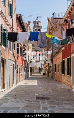 Clothes laundry left to dry at the window of a old medieval building in Venice, Italy Stock Photo