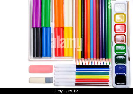 Children, school set for creativity and drawing from colored pencils, watercolor paints, felt tip pens and plasticine Stock Photo