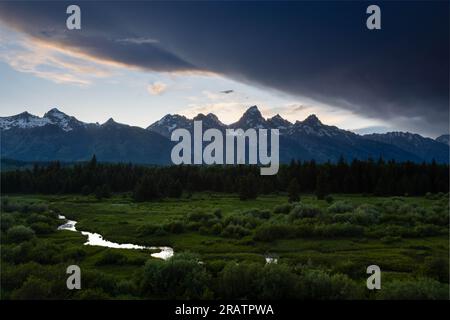 Large storm clouds clearing over the Teton Mountains and Blacktail Ponds. Grand Teton National Park, Wyoming Stock Photo