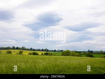 Lenticular cloud formations over the hills and fields of the North Pennines in England Stock Photo