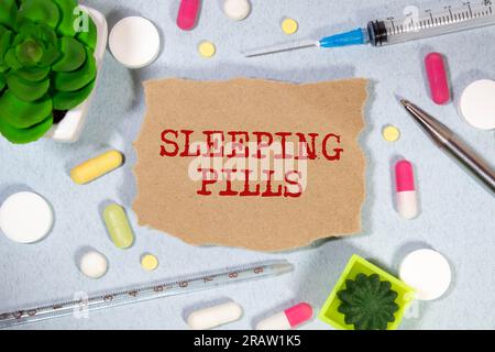 SLEEPING PILLS text on a letterhead in a medical folder on a beautiful background. Stock Photo