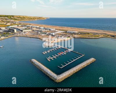 Isle of Portland, Dorset, UK.  5th July 2023.  Aerial view from the air of the Weymouth & Portland National Sailing Academy at Portland harbour near Weymouth in Dorset.  The asylum accommodation barge the Bibby Stockholm is due to be berthed nearby at Portland Port this month.  Picture Credit: Graham Hunt/Alamy Live News Stock Photo