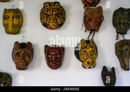 Mayan wooden, handcrafted masks on market for sale in Chichicastenango, Guatemala Stock Photo