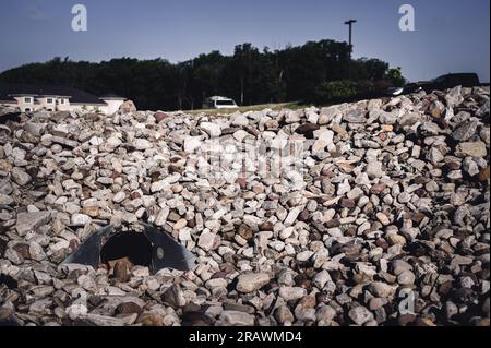 underground drainage storm drain with winged walls surrounded by rock for erosion control  Stock Photo