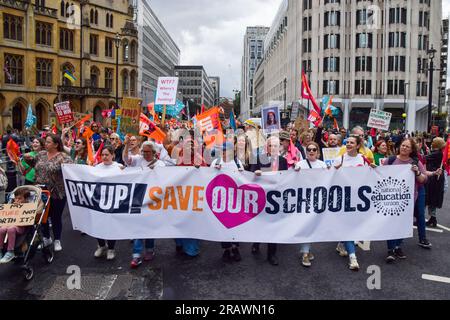 London, UK. 05th July, 2023. Protesters march with a 'Save our schools' banner during the demonstration. Thousands of teachers marched in Westminster as the National Education Union (NEU) stage fresh strikes over pay. Credit: SOPA Images Limited/Alamy Live News Stock Photo