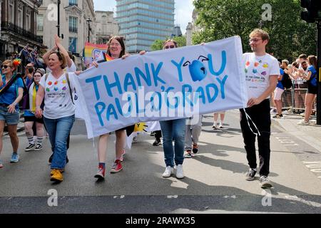 London, UK. Pride in London Parade marchers representing Battersea Cats and Dogs Home thank Paul O'Grady for his long term support. Stock Photo