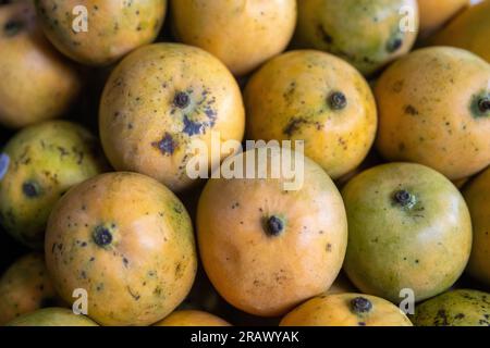 Bunch of Mangos Stacked at a super market Stock Photo