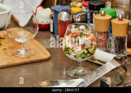 Salmon, Cucumbers, and Herbs with a Creamy Twist in Glass, Garden Fresh Bliss. Stock Photo