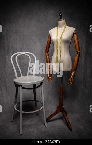 Wooden female dressmakers mannequin, retro style with arms and adjustable stand Stock Photo