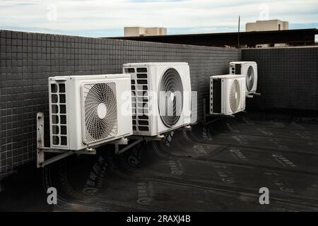 The air conditioning outdoor unit placed on the rooftop. Stock Photo