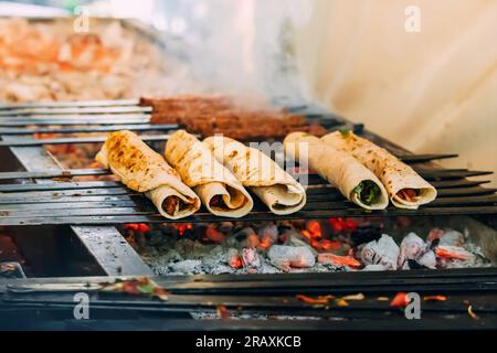 Cooking turkish fastfood - durum or doner Stock Photo