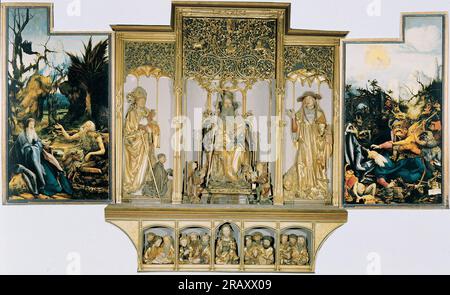 The second view of the altar. St Anthony Visiting St Paul the Hermit in the Desert (left), The Temptation of St. Anthony (right). Central part are carved figures of St. August, St. Anthony, St. Jerome; bottom part Jesus with 12 Apostles. 1515 by Matthias Grünewald Stock Photo