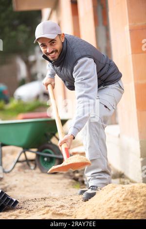 close up of road builder holding shovel Stock Photo