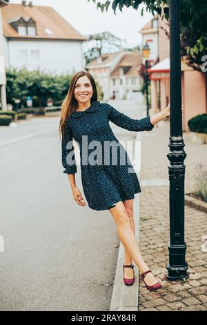 Pretty girl wearing a mini dress in a night club location Stock