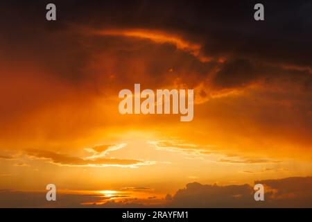 Dramatic sky with storm clouds during sunset. Summer stormy weather Stock Photo