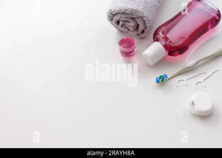 Mouthwash and other oral hygiene products on white background with copyspace Stock Photo