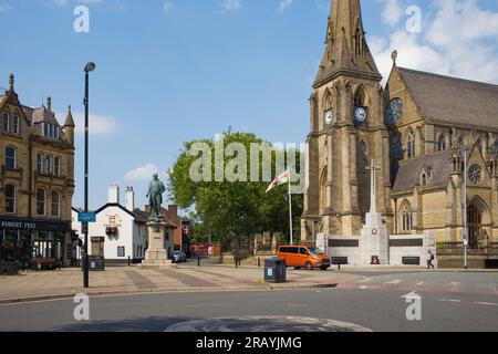 Square in Bury with Sir Robert Peel statue and war memorial Stock Photo