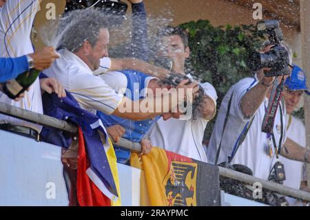 Rory McIlroy of Team Europe celebrates with champagne on the balcony of the clubhouse following Europe's victory in the 2010 Ryder Cup at the Celtic Manor Resort on October 4, 2010 in Newport,UK. Stock Photo