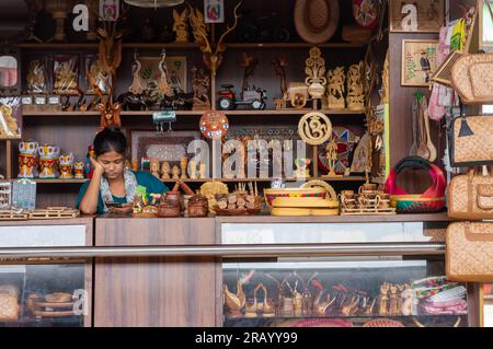A lady in her shop selling handmade products. Asansol Railway Station West Bengal India June 20, 2023 Stock Photo