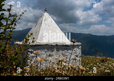 A small temple on a hilltop. These small dome temples are typical in the Himalayan region of Uttarakhand. Stock Photo